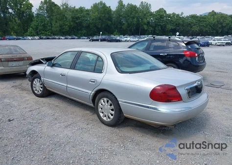 1999 Lincoln Continental из США, поврежденный, VIN 1LNHM97V5XY630004